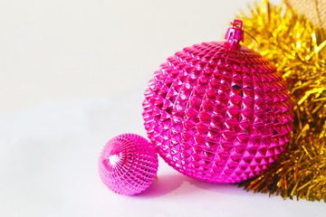 pink christmas toys balls with new year gold tinsel