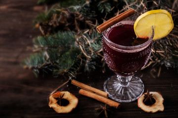 Mulled wine with spices and fruits. Copyspace