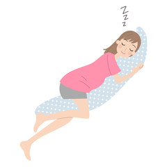 枕を抱いて眠る妊婦