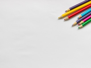 colored pencils on a white background, blank for the designer