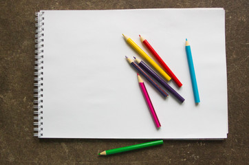 colored pencils on a white background, blank for the designer