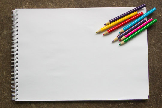 colored pencils on a white background, blank for the designer