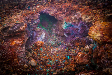 Bright multi-colored minerals on the slope of the volcano (Kamchatka, Russia) Rock formation after eruption.