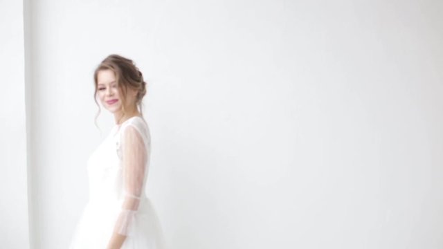 Elegant tender bride on a white background