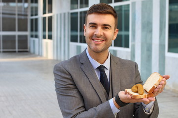 Businessman showing a poop sandwich
