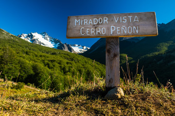 Sign in Chilean mountains with ice caped mountain on the background