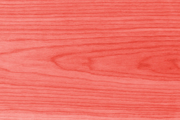 Background, the structure of a wooden kitchen board (brashing), macro, top view - living coral