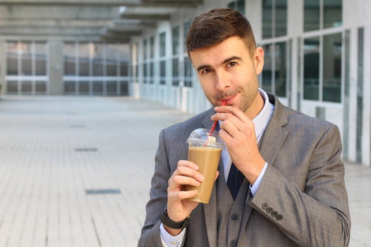 Cheerful businessman during coffee break