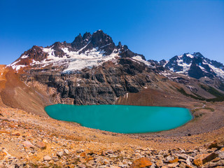 Cerro Castillo mountain and lake with turquoise water near it. Chile