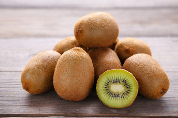 Fresh kiwi fruit on grey wooden background