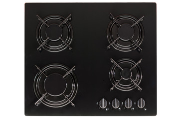 Burners on a black glass gas cooker in the kitchen