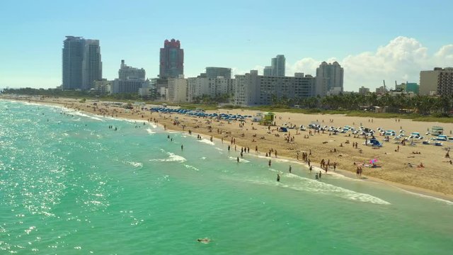 Premium aerial stock footage of a crowded Miami Beach