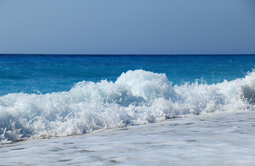 A splash of sea wave on the beach