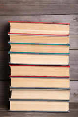 Old vintage books on grey wooden table