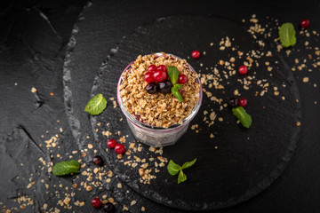 Сhia pudding or yogurt with granola, mango or peach. Healthy breakfast concept and idea. Detox and healthy superfoods.