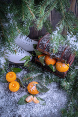 Fototapeta na wymiar Winter still life with skates and tangerines.