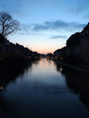 Naklejka premium winter evening sky reflected on the water - Strasbourg - France