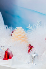 Obraz na płótnie Canvas White christmas tree decoration in december./ Every december cool and white christmas tree decoration with colourful bauble, mask, snow man, giftbox.