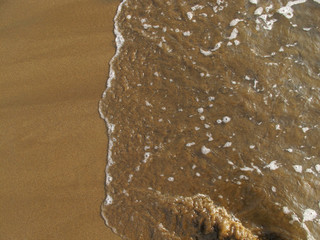 Beach Atmosphere in the Morning, Brown Sandy Beach Soaked By Sea Waves