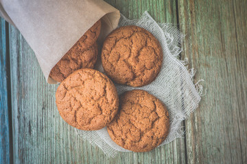 Sweet oat  cookies on a wooden table.