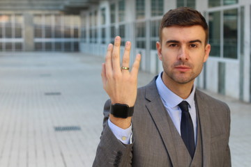 Businessman showing his wedding ring 