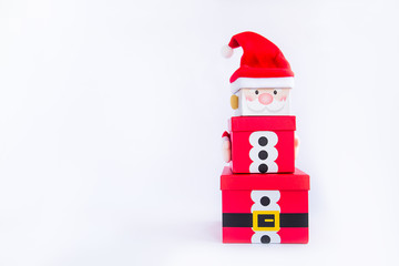 Christmas gift boxes tower in the shape of a Santa Clause on white background isolated. Xmas. family holiday concept. Merry Christmas and Happy Holidays. Selective focus. Copy space.