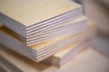 Close-up of plywood sheets at carpentry on wooden table