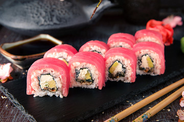 Tuna Sushi Roll with eel, cream cheese Philadelphia and avocado Sushi menu. Japanese food. 