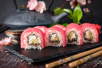 Tuna Sushi Roll with eel, cream cheese Philadelphia and avocado Sushi menu. Japanese food. 