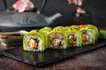 Vegetarian sushi rolls avocado with cream Philadelphia cheese, sesame, unagi sauce. Sushi menu....