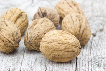 walnuts on old wooden background