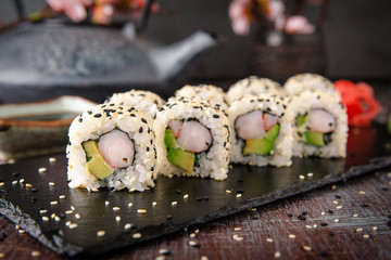 Sushi roll sushi with prawn, avocado, cream cheese, sesame. Sushi menu. Japanese food. 