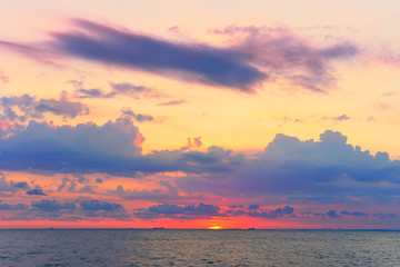 Dawn on the sea. The view from the water of the rising sun and the beautiful sky. Marine landscape. Odessa. Black Sea.
