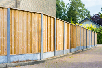 New wooden fence along the street