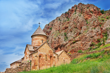 Fototapeta na wymiar Scenic Novarank monastery in Armenia. against dramatic sky. Noravank monastery was founded in 1205. It is located 122 km from Yerevan in narrow gorge made by Darichay river nearby city of Yeghegnadzor