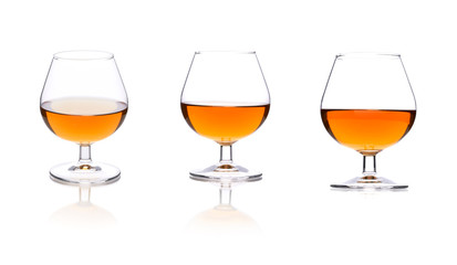 Three brandy glasses isolated on a white background