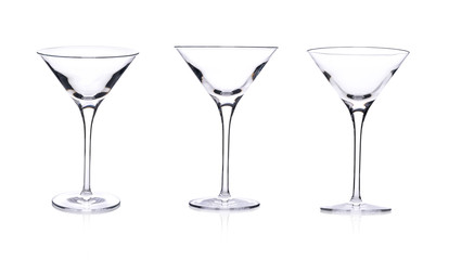 Three empty martini glasses isolated on white background