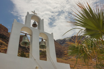 The crosses on the bell towers of some Greek churches