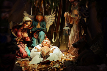 Christmas Nativity scene in the church, virgin Mary and Saint Joseph with Holy infant Jesus - 238195982