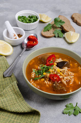 Thick red soup with pasta