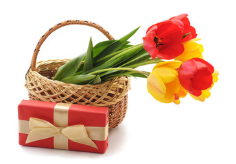 Fototapeta na wymiar Bouquet tulips in a basket with gift.