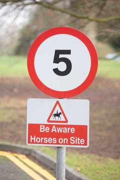 5mph sign and beware of horses sign