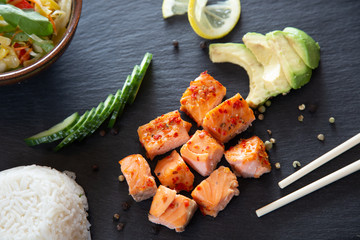 Poke bowls with salad and cucumber on the slate