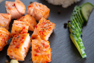 Poke bowls with salad and cucumber on the slate