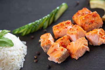 Poke bowls with salad and cucumber on the slate