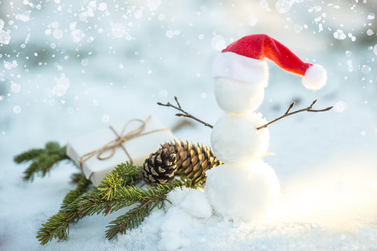 snowman wearing a santa hat