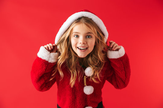 Cute cheerful little girl wearing Christmas costume
