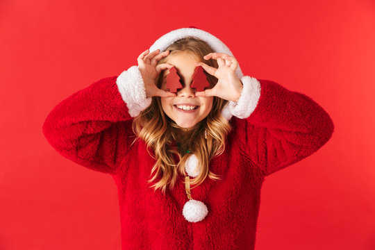 Cute cheerful little girl wearing Christmas costume