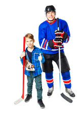 Professional hockey player with young boy on white