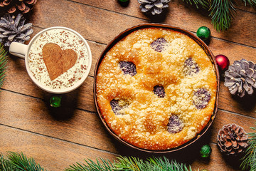 Christmas pie on wooden table. Personal point of view
